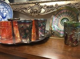 Collection of various patterns and colors of carnival glass tumblers.  All are original as far as we can tell
