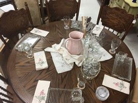 Round oak pedestal table with leaf to make oblong table with six matching chairs, retaunglar lunch set, candlewick glasses