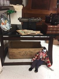 modern glass top desk, clown puppet, old box