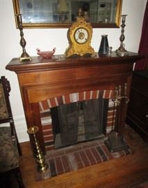Electric fireplace, brass candle sticks, antique clock, misc. glass