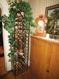 Primitive cupboard, antique mantle clock, Tall metal wine rack, rolling pin collection