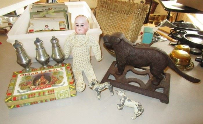 Sterling shakers, antique doll (missing hair), cast iron dog nut cracker, reproduction cigar labels in box, etc.