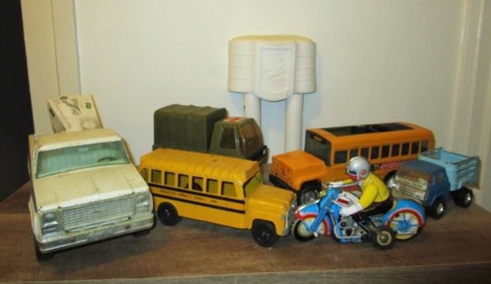 Metal Tonka trucks, metal school buses, tin motorcycle toy