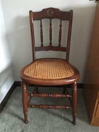 4 wooden,  hand caned chairs