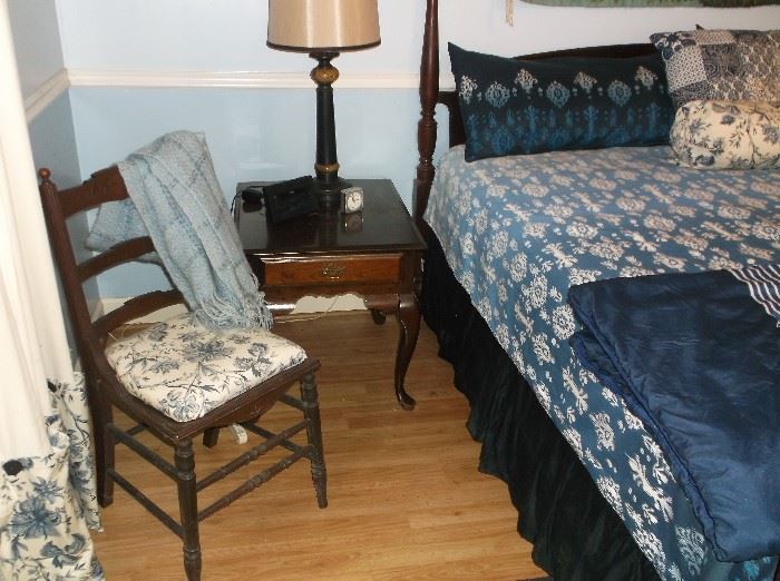 King size bed and one of a pair of side tables