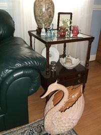 Mahogany side table and terra cotta swan
