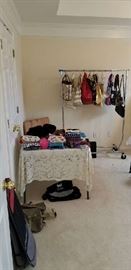 Lots of cosmetic bags. The rack at back has a few of the best designer handbags
