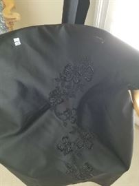 This fabric was to make a dress it also has a bolt of black "silk" fabric that comes with it.  I think it's suitable for framing