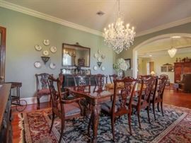 Henredon dining room table with 10 chairs--notice the hand knotted wool rug that's 10' by 14'