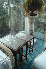 Large marble pedestal and rattan nest of tables.