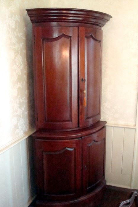 Mid 1800's half round mahogany china cabinet. Great item for a colonial home.
