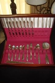 The other set of silver plate flatware.