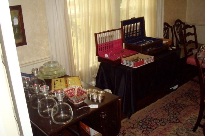 Antique table, bottles, silver plate sets & etc.