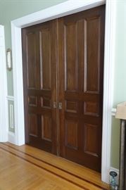 Giant pocket doors with original hardware and a top track that is so smooth!