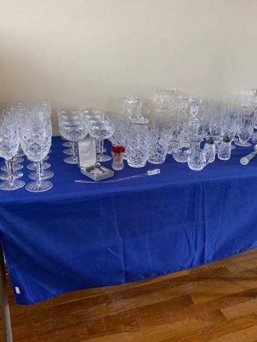 Large collection of Waterford crystal.  Water glasses, martini glasses, white wine, red wine, candle holders, pitcher and more.