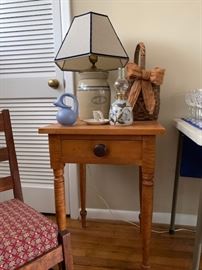 Antique side table and vintage decor including jar lamps, baskets, oil lamps and more.