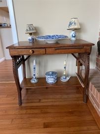 Antique desk with pullout writing drawer.