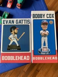 Bobby Cox and Evan Gattis bobble head dolls.