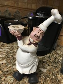 chefs statue carrying a bowl 