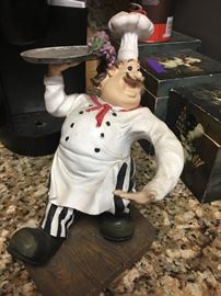chefs statue carrying a serving tray