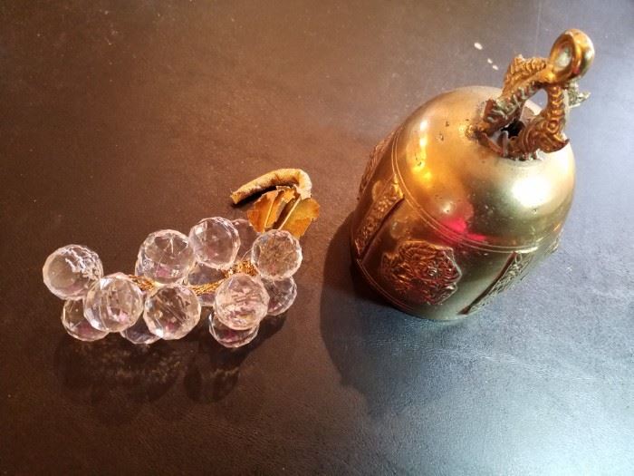 Crystal grapes and neat brass bell