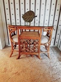 Rattan glass topped table with 2 pullout chairs