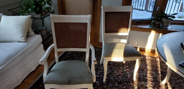 Showing that the two end chairs have arm rests