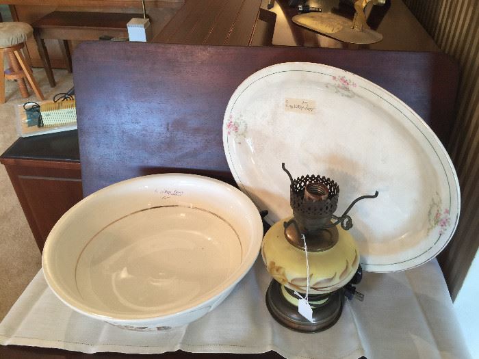 Close look at wash bowl, platter and lamp