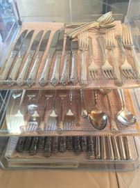 Sterling flatware, the top two shelves are Damask Rose