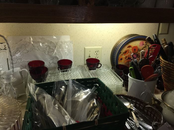 Lots of flatware, and snack trays with red cups