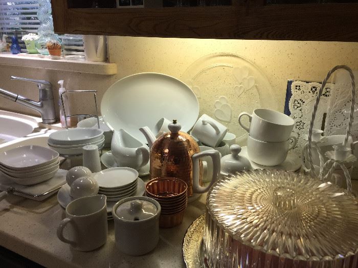 White every day china, vintage cake dish, copper covered tea pot.