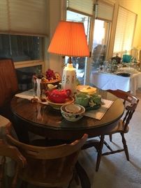Antique Oak table with two leaves, lots of vintage pottery and a Mid-Century Lamp