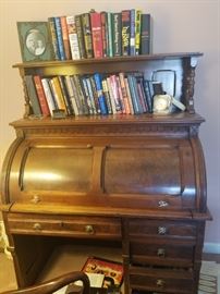 Antique roll top desk with additional top for books etc.