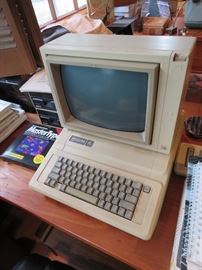 Apple IIe Desktop Computer with accessories and software