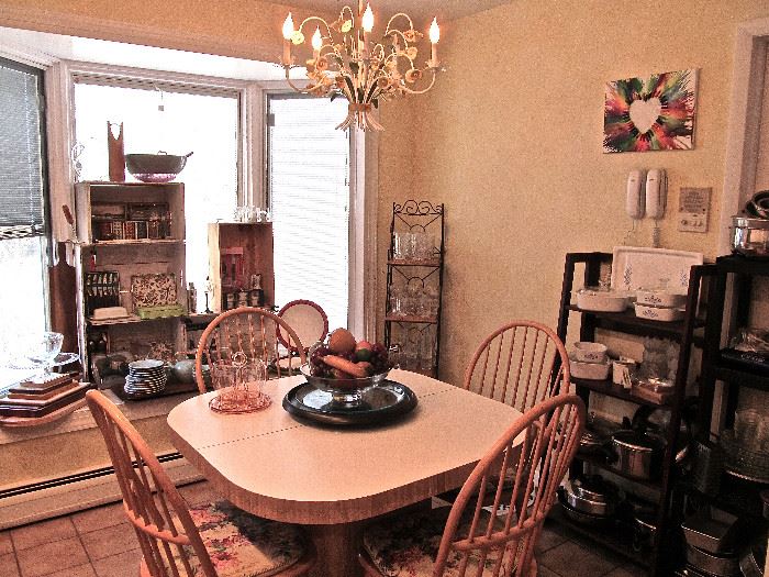 KITCHEN TABLE WITH EXTENSION AND 4 OAK CHAIRS, CORNING WEAR, PYREX, GLASS WEAR, BAKE WEAR, CUTTING BOARDS LARGE SERVING BOWLS, WOOD FRUIT CENTERPIECE, ITALIAN WROUGHT IRON LIGHT FIXTURE.