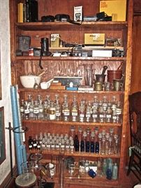 HUGE COLLECTION OF ANTIQUE PHARMACY AND APOTHECARY JARS AND EQUIPMENT FROM THE OWNERS PHARMACY . 