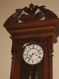 Victorian style crested wall clock w/ chimes on the hour and half hour
