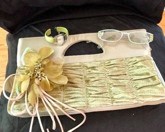 Green purse with matching watch and glasses