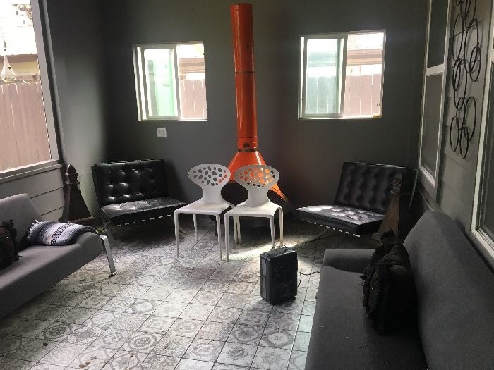 2 White plastic chairs. 2 black chairs. 2 grey, long Couches.
Fireplace not for sale.