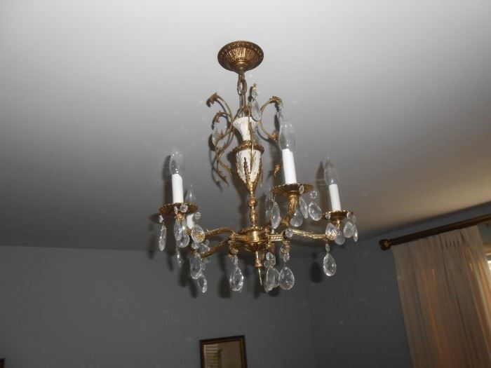 Smaller chandelier in the master bedroom - make an offer and be prepared to take it down and use wire screws to cap it