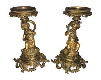 Fantastic pair of Italian bronze or Nate cherub candleholders. Great piece to use with a candle, with an insert for floral arrangements, or as a base for platters. Very heavy and quality piece.