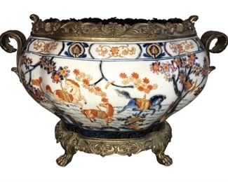 Decorative porcelain footed urn. The crackled navy, burnt orange and gold accent design brings elegance and texture to the Bombay shape.
