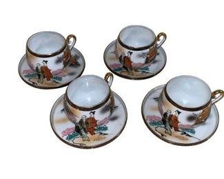 Unusual Moriage Japanese Lithophane Geigha cup and saucer, tea Cups and saucers set for 4<br> <br> Fine detail and paper thin porcelain.<br> <br> When you hold up the bottom of the tea cup to the light, a hologram of a woman's face appears. Fine quality and detailing. A must have and conversation piece for any collector. 