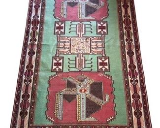 Finely woven, hand knotted kilim rug. Gorgeous green, red and ivory tones will add dimension and elegance to any decor. The tightly woven silk thread add sheen and beauty to the geometric design. 