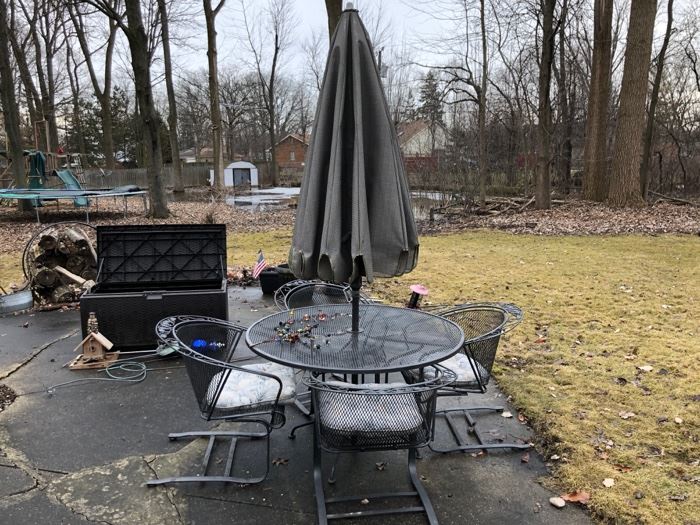 Another metal patio set with 6 chairs, umbrella and a small table.  Suncast patio storage box. 