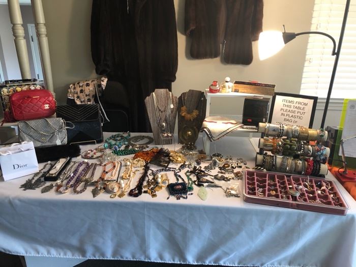 A table full of beautiful jewelry. 