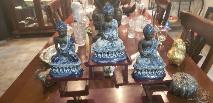 Three blue and white Sitting Buddahs.