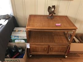 #29	tan wicker tv stand w shelf and swivel top  on wheels30x18x29	 $75.00 	