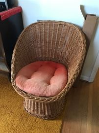 #50	brown wicker chair w orange cushion 	 $50.00 
