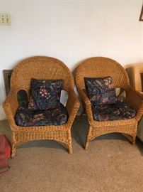 #80	(2) brown wicker chairs w blue cushions $ 75 ea.	 $150.00 
